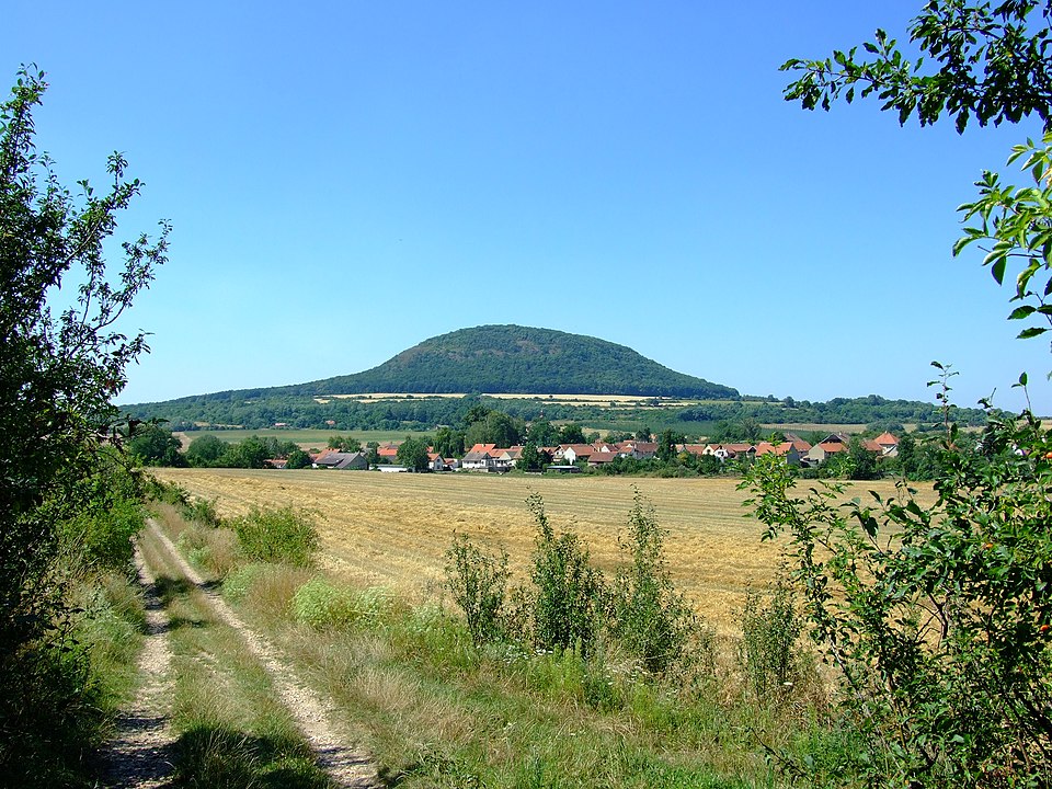 Photo: Říp hill and Ctiněves village, Czech Republic Author: Aktron / Wikimedia Commons Source:  https://commons.wikimedia.org/wiki/File:Ctin%C4%9Bves,_%C5%98%C3%ADp_a_obec.jpg License: Creative Commons Attribution-Share Alike 3.0 Unported (CC BY-SA 3.0)